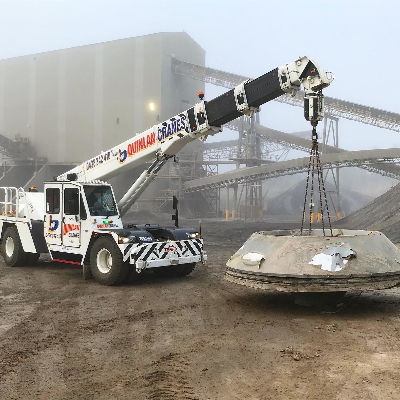 Quinlan Crane On Site Lifting Heavy Cement Objects