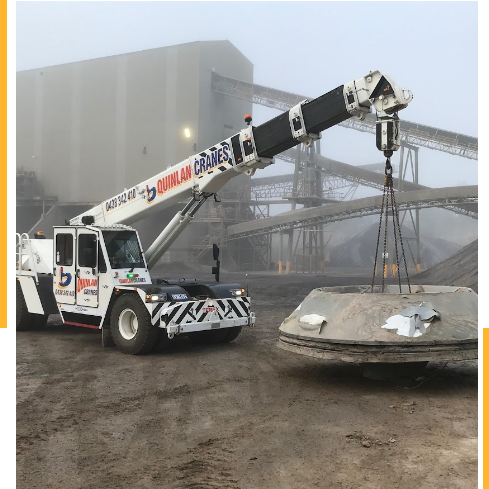Franna Crane Picking Up Heavy Concrete Object