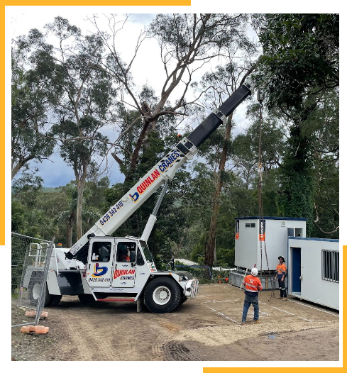 White Franna Crane Picking Up Portable Office